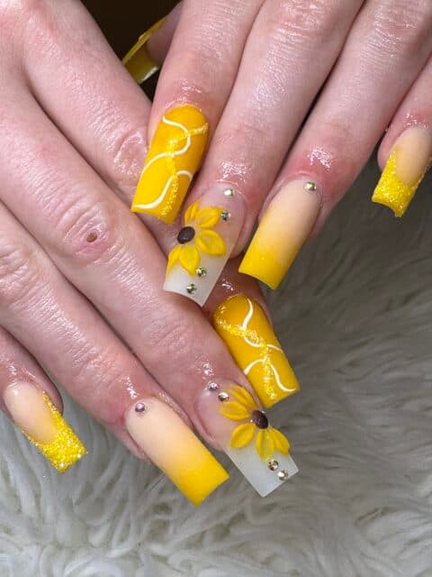 Sunflower and gold glitter nails from last season at the South Side salon