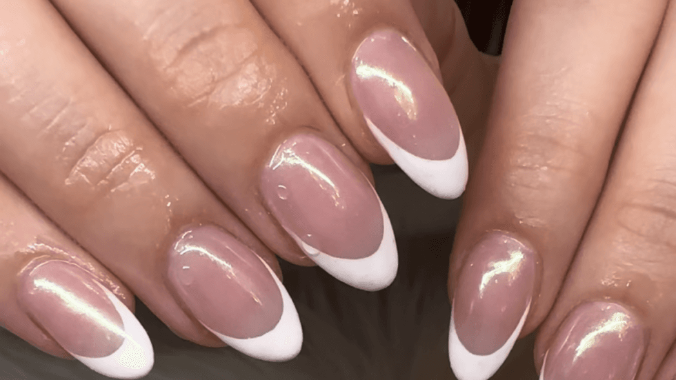 Glazed French manicure with gold shimmer