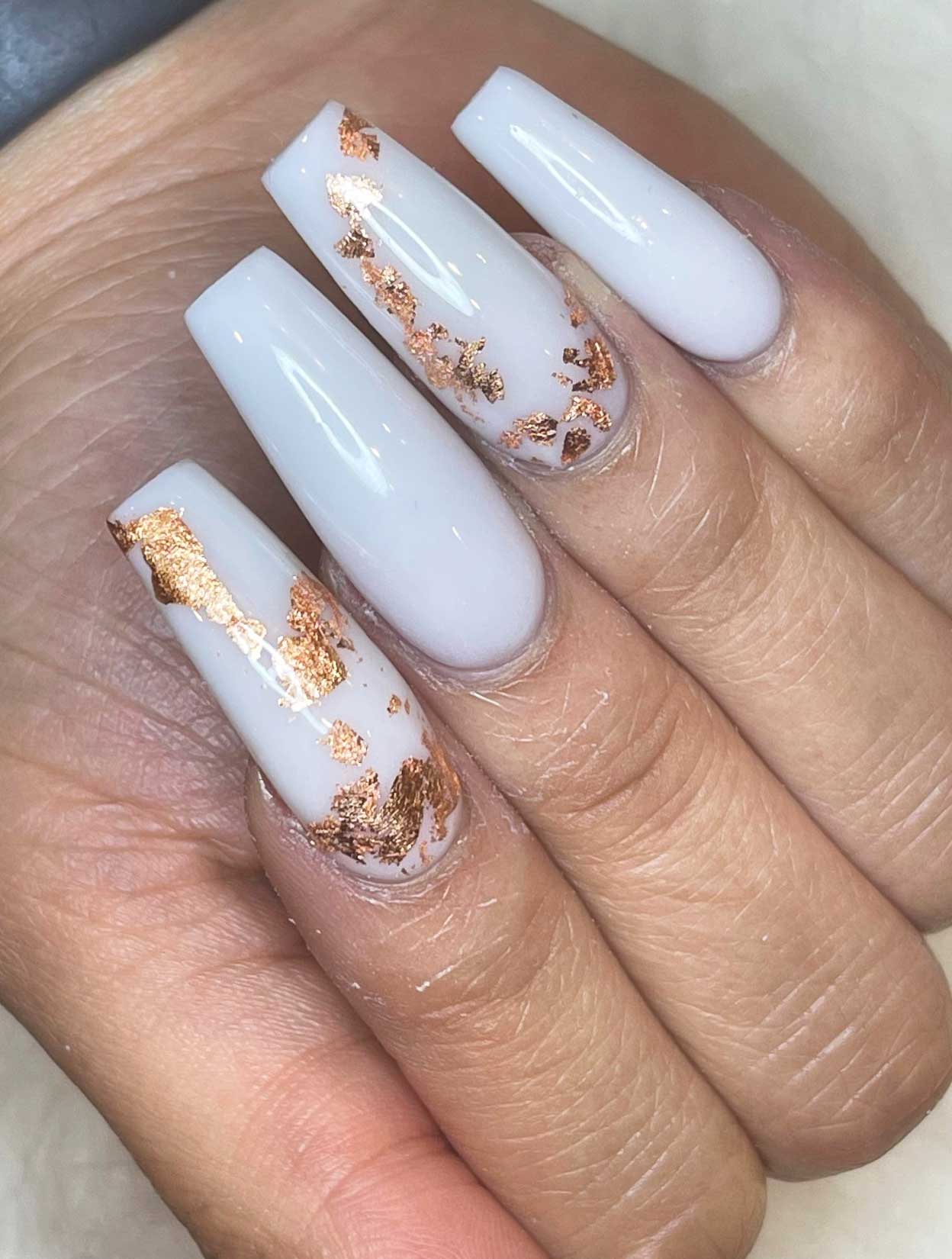 Cream nails with gold foil — fall nail art from Gossip & Nail Spa South Side