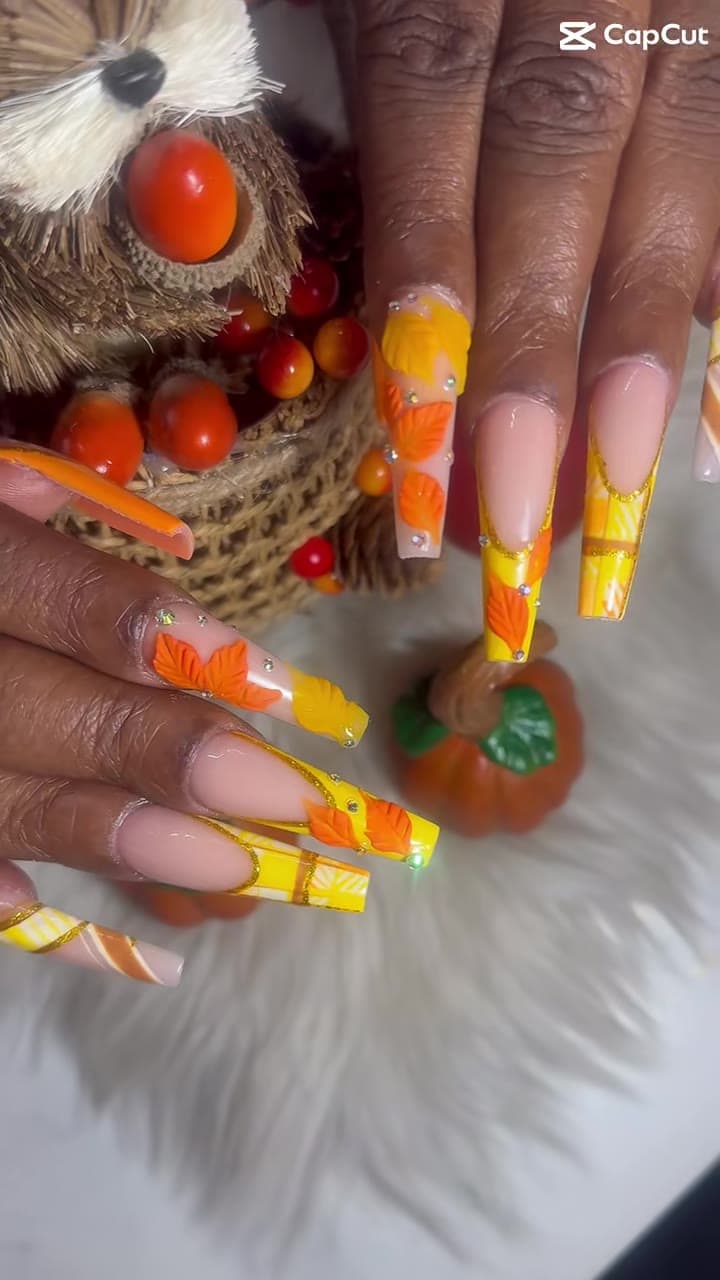 3D fall leaf nails with a pumpkin prop from TikTok @gossipandnailspa